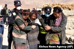 Rescuers transfer people injured in an earthquake at Zhacun Village of Dingri County in Xigaze, southwest China's Tibet Autonomous Region, Jan. 7, 2025.