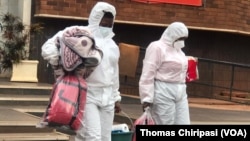 Joana Mamombe naCecilia Chimbiri In Hasmat Suit 2