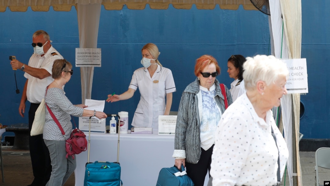 Passengers undergo temperature check as a part of precautionary measures to prevent the spread of new Corona virus before they board a cruise at the Colombo Port in Colombo, Sri Lanka, Thursday, Feb. 6, 2020. As on Thursday, a viral outbreak that…