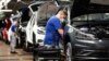 FILE - A worker toils on a Volkswagen assembly line in Wolfsburg, Germany, April 27, 2020. Investors and human rights activists are criticizing VW over claims made by the company's China chief that he saw no evidence of forced labor during a visit a VW plant in Xinjiang, China.