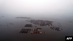 En esta imagen sin fecha distribuida el miércoles 31 de julio de 2024 por el gobierno de Corea del Norte, se muestra una zona afectada por las inundaciones en la ciudad de Sinuiju, en la provincia de Phyongan Norte, Corea del Norte. 