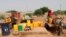 Residents fill up water containers in Dori, Burkina Faso, July 7, 2021. Violence by fighters linked to al-Qaida and the Islamic State in Burkina Faso is on the rise, and with it, so is the recruitment of child soldiers, according to reports.