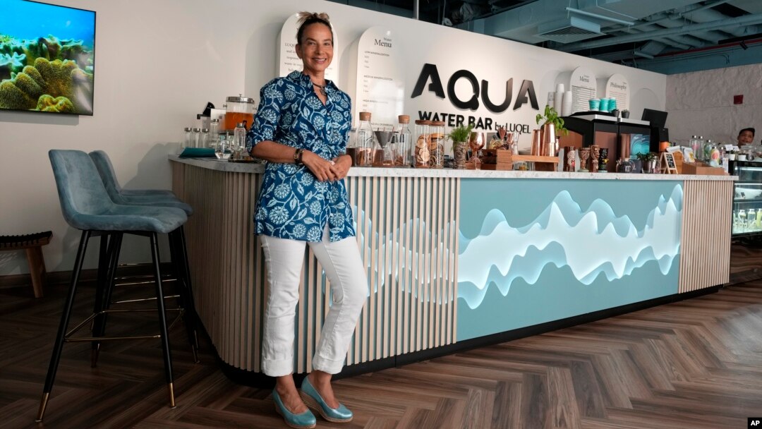 Roia Jabari, managing director of AQUA Water Bar by LUQEL poses at her store in Dubai, United Arab Emirates on July 11, 2023. (AP Photo/Kamran Jebreili)