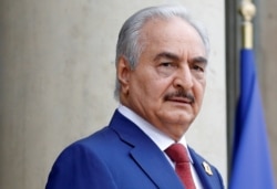 FILE - Khalifa Haftar arrives to attend an international conference on Libya at the Elysee Palace in Paris, France, May 29, 2018.