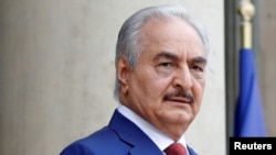 FILE - Khalifa Haftar, the military commander who dominates eastern Libya, arrives at an international conference on Libya at the Elysee Palace in Paris, May 29, 2018. 