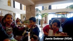 Syrian children at the Mediterranean Palace Hotel enjoying their respite from the hunger, cold and misery of the refugee trail, Thessaloniki, Thessaloniki, northern Greece, March 6, 2016. (Photo: J.Dettmer/VOA). 