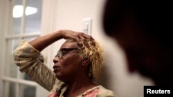 FILE - A patient describes her migraines at the Venice Family Clinic in Los Angeles, Feb, 16, 2011.