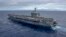FILE - The aircraft carrier USS Carl Vinson crosses the Pacific Ocean on a regularly scheduled Western Pacific deployment, Feb. 3, 2017.