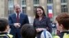 FILE - Britain's Prince William, Duke of Cambridge, and his wife Kate, Duchess of Cambridge meet young French rugby fans at the Trocadero square, in Paris, March 18, 2017.