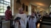 FILE - Choir members sing hymns at Christ Church in Philadelphia during Sunday service, Oct. 6, 2024. 