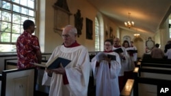 FILE - Choir members sing hymns at Christ Church in Philadelphia during Sunday service, Oct. 6, 2024. 