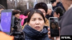FILE - Inga Imanbai talks to reporters in Almaty, Kazakhstan, Feb. 22, 2020. (Petr Trotsenko/RFE/RL)