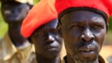 FILE - South Sudanese soldiers listen during a briefing at the army general headquarters in Juba, Jan. 8, 2014. 