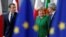 French President Emmanuel Macron, Germany's Chancellor Angela Merkel and Italy's Prime Minister Paolo Gentiloni arrive at a European Union heads of state informal meeting in Brussels, Belgium, Feb. 23, 2018.