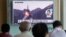 People watch a TV news program showing a file footage of North Korea's ballistic missile that the North claimed to have launched from underwater, at Seoul Railway station in Seoul, South Korea, Aug. 24, 2016. 