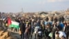 Displaced Gazans cross the Netzarim corridor from the southern Gaza Strip into Gaza City on Jan. 27, 2025.