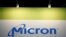 FILE - The logo of U.S. memory chip maker Micron Technology is pictured at its booth at an industrial fair in Frankfurt, Germany, July 14, 2015. 