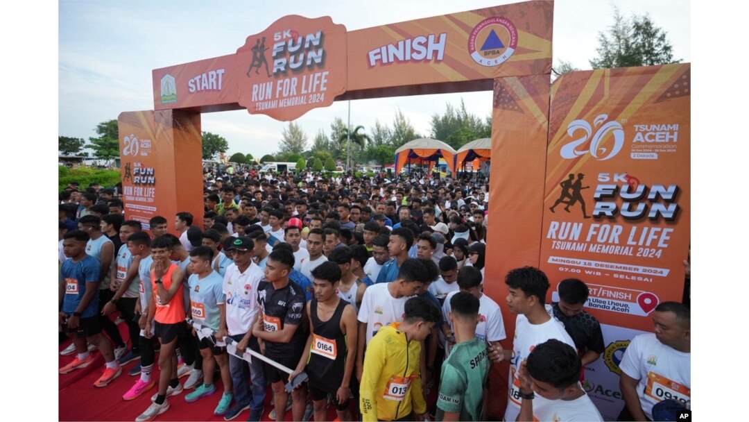 Participants prepare for the start of a 5km running event titled 'Run for Life, Tsunami Memorial 2024' held to commemorate the 20th anniversary of the Indian Ocean tsunami, in Banda Aceh, Aceh province, Indonesia, Dec. 15, 2024.