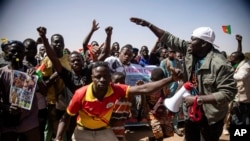 FILE - People take to the streets of Ouagadougou, Burkina Faso, Jan. 25, 2022. to rally in support of the new military junta that ousted democratically elected President Roch Marc Christian Kabore and seized control of the country.