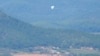 North Korean balloons are seen from the Unification Observation Post in Paju, South Korea, near the border with North Korea, Oct. 4, 2024. 