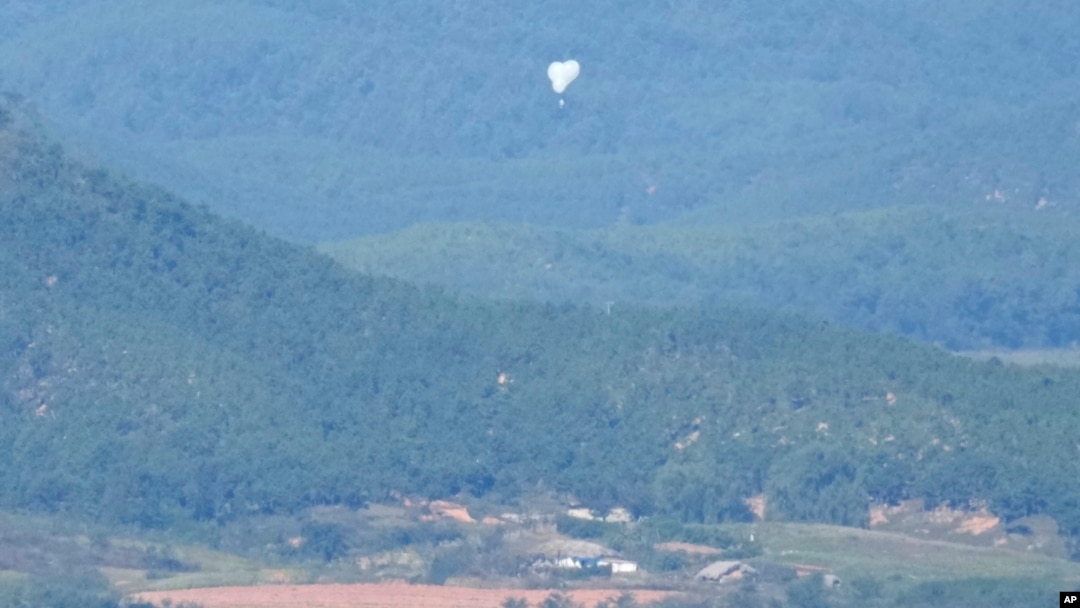 North Korean balloons are seen from the Unification Observation Post in Paju, South Korea, near the border with North Korea, Oct. 4, 2024. 