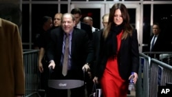 arvey Weinstein, accompanied by defense attorney Donna Rotunno, leaves a Manhattan courtroom during his rape trial in New York, Feb. 7, 2020. 