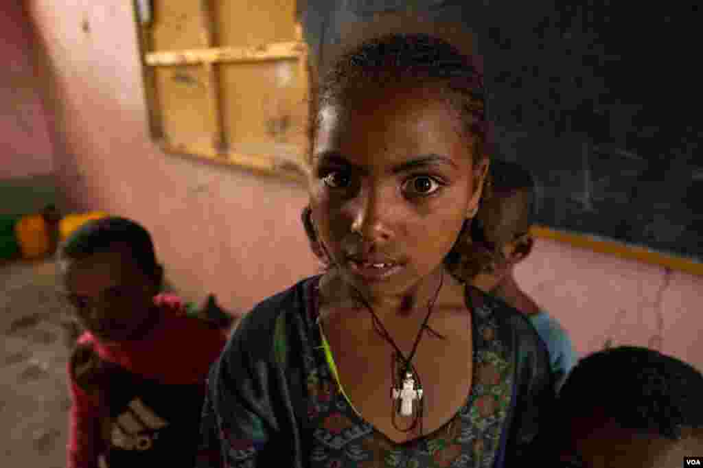 A young girl lives in a classroom on June 3, 2021, in Mekelle, Ethiopia. About 2 million people have been displaced since November 2020, when the war began.