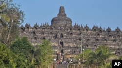 Tourists visit Borobudur Temple in Magelang, Central Java, Indonesia, Aug. 12, 2019. 
