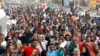 Sudanese protesters march during a demonstration in Khartoum, Sudan, Thursday, Aug. 1, 2019. 