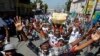 Les manifestants demandent la démission du président haïtien Jovenel Moise lors d'une marche dirigée par la communauté artistique de Port-au-Prince, à Haïti, le 13 octobre 2019.