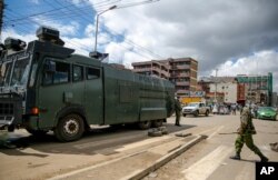 A police water cannon truck blocks a street to prevent residents from leaving the Eastleigh area of Nairobi, May 7, 2020.