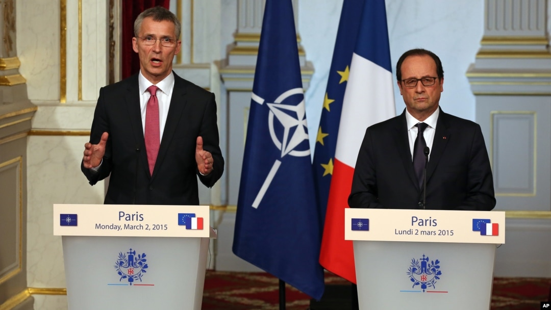 NATO Secretary-General Jens Stoltenberg of Norway, left, speaks during a joint news conference with French President Francois Hollande, after their meeting at the Elysee Palace in Paris, March 2, 2015.