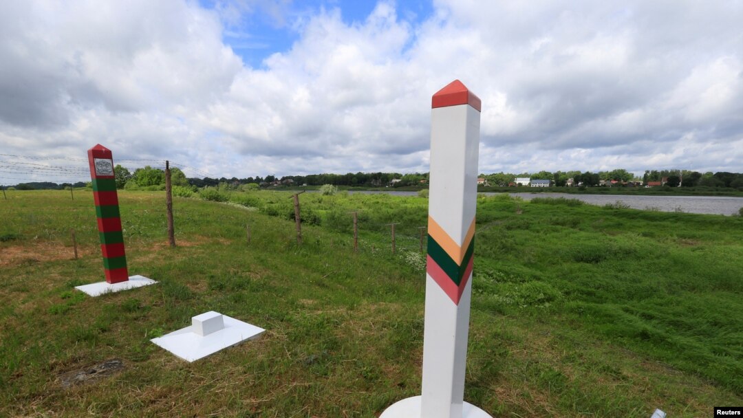 FILE PHOTO: Lithuanian and Russian border signs are seen near Sudargas border crossing point with Russia in Ramoniskiai