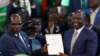 FILE: Kenya's Deputy President William Ruto (right) reacts after being declared the winner of Kenya's presidential election at the IEBC National Tallying Centre at the Bomas of Kenya, in Nairobi, Kenya August 15, 2022.