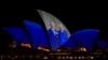 The Sydney Opera House sails show photos of Britain's King Charles and Queen Camilla soon after their arrival in Sydney, Oct. 18, 2024.