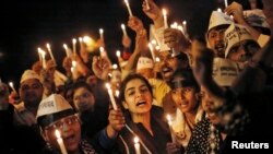 FILE - Candle light vigil to protest the rape of a female Uber passenger, in New Delhi, Dec. 8, 2014.