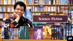 FILE - In this Feb. 4, 2004 file photo, author Octavia Butler poses near some of her novels at University Book Store in Seattle, Wash. (Joshua Trujillo/seattlepi.com via AP, File)