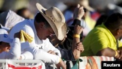 People attend the Mass celebrated by Pope Francis in Ciudad Juarez, Mexico, Feb. 17, 2016.