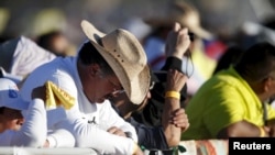 People attend the Mass celebrated by Pope Francis in Ciudad Juarez, Mexico, Feb. 17, 2016.