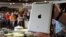 An Apple iPad which belonged to Pope Francis is seen at Castells auction house in Montevideo, April 14, 2015. 