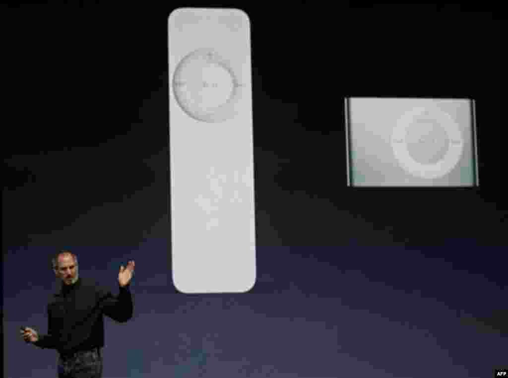 Apple Computer CEO Steve Jobs gestures during announcement of the new iPod Shuffle, right, as the older Shuffle, left, at an Apple event in San Francisco, Tuesday, Sept. 12, 2006. Jobs also announced a new iPod nano with a 24-hour battery life and new gam