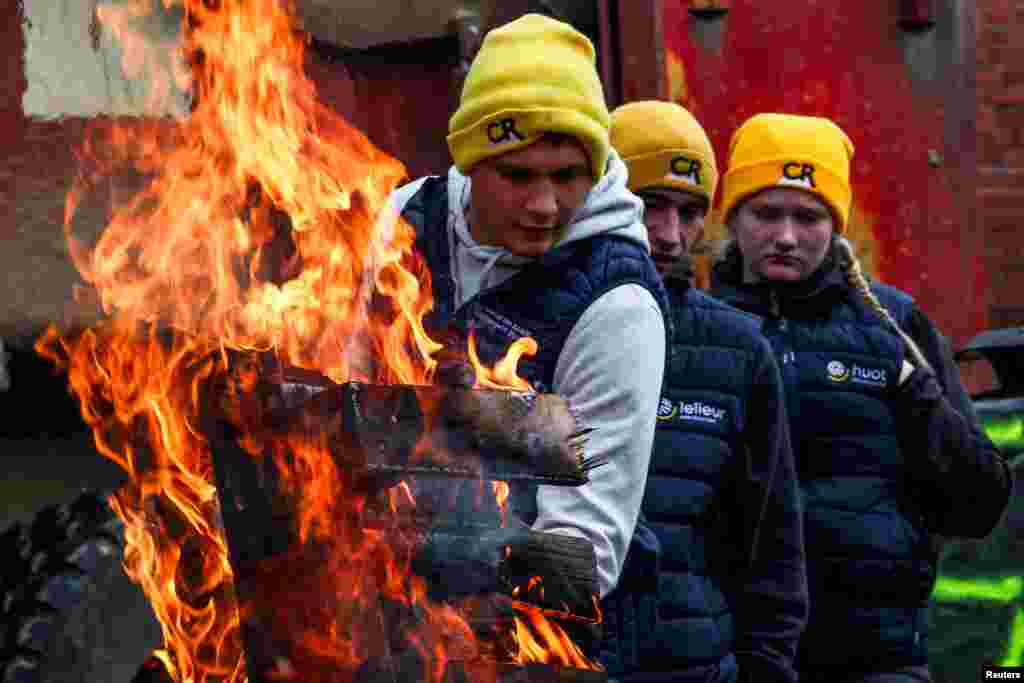 Farmers burn a wooden pallet to warm themselves during a protest against the EU-Mercosur Trade Agreement, in Strasbourg, France.