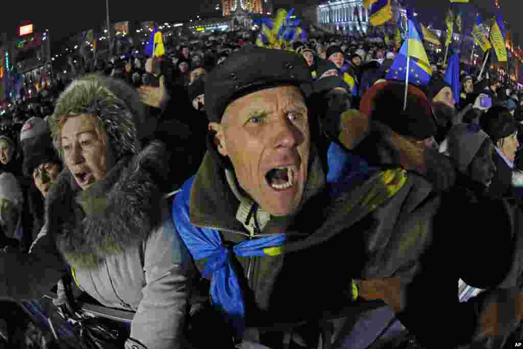 Pro-European Union activists shout as they listen to Ukranian opposition leader Oleh Tyahnybok, during a rally in the Independence Square in Kyiv, Ukraine, Dec. 13, 2013.