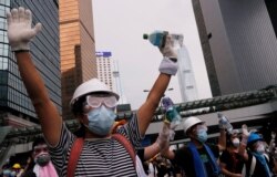 Protesters demand that authorities scrap a proposed extradition bill with China, in Hong Kong, June 12, 2019.