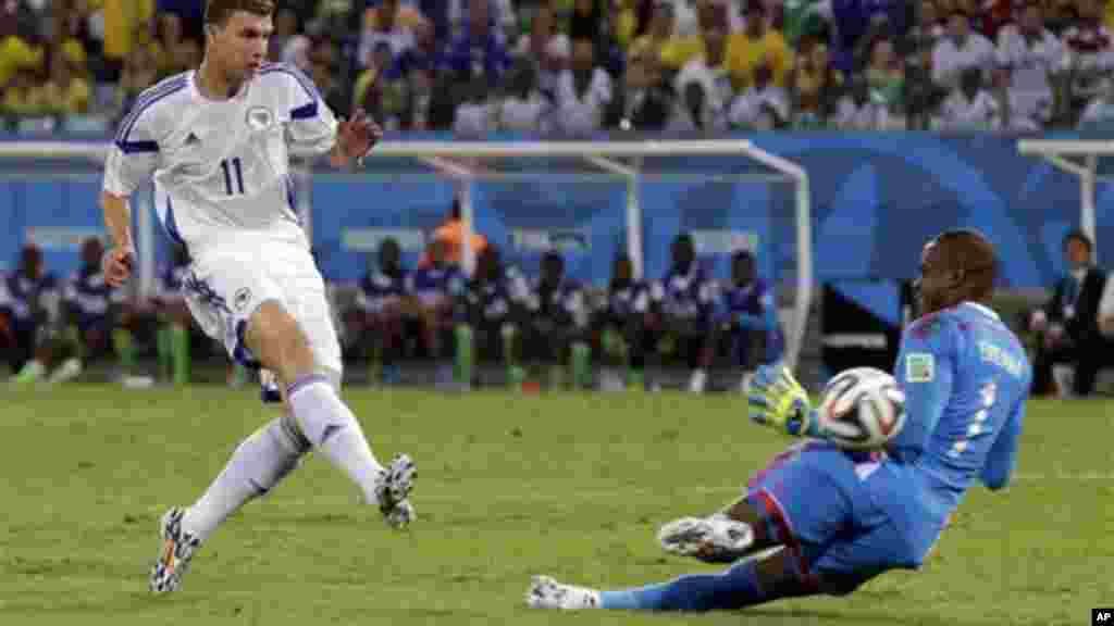 Nigeria's goalkeeper Vincent Enyeama makes a save on a shot by Bosnia's Edin Dzeko.