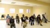 FILE - People wearing protective masks sit ahead of a vaccination, as South Africa rolls out the coronavirus disease (COVID-19) vaccines to the elderly at the Munsieville Care for the Aged Centre outside Johannesburg, South Africa, May 17, 2021.