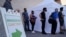 People wait in line for COVID-19 vaccinations at an event at La Bonita market, a Hispanic grocery store, July 7, 2021, in Las Vegas, as the areas with the lowest vaccination rates have the highest rates of new cases. 