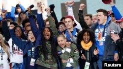 Students celebrate at the end of the March for Our Lives event in Washington, D.C., March 24, 2018.