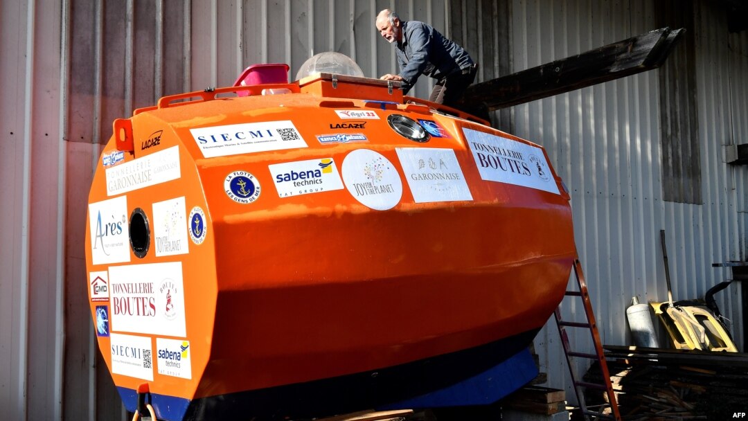 Jean-Jacques Savin, a former paratrooper, 71, works on the construction of a ship made from a barrel at the shipyard in Ares, southwestern France, Nov. 15, 2018. He is several days into his attempt to cross the Atlantic in a specially-built orange barrel, Dec. 31, 2018.