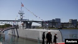 The autonomous ship Sea Hunter, developed by the Pentagon's Defense Advanced Research Projects Agency, is shown docked after its christening ceremony in Portland, Oregon, April 7, 2016. (REUTERS/Steve Dipaola)